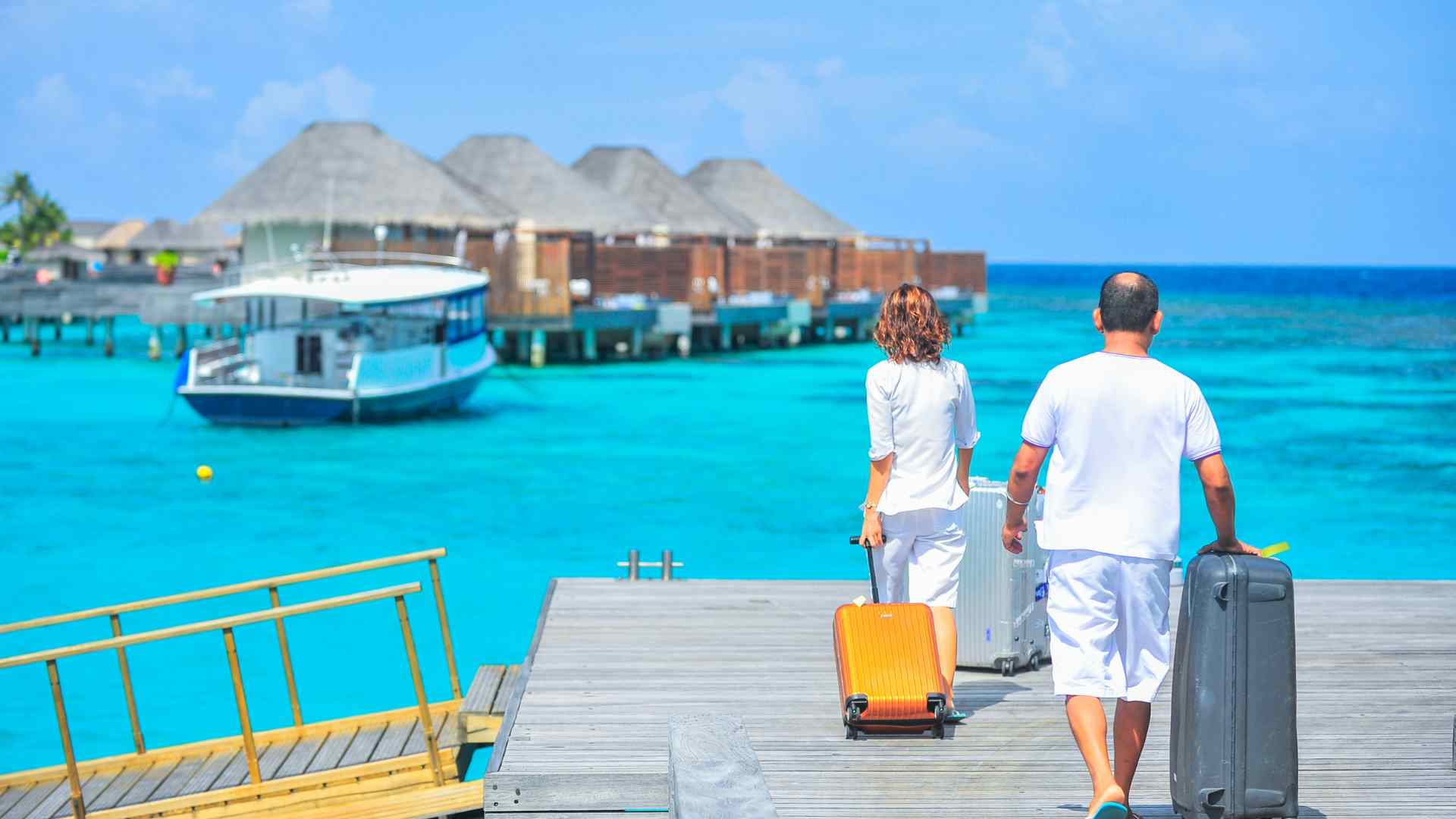 Vietnam and Cambodia overwater villas style timber rooms raised on posts above still green water