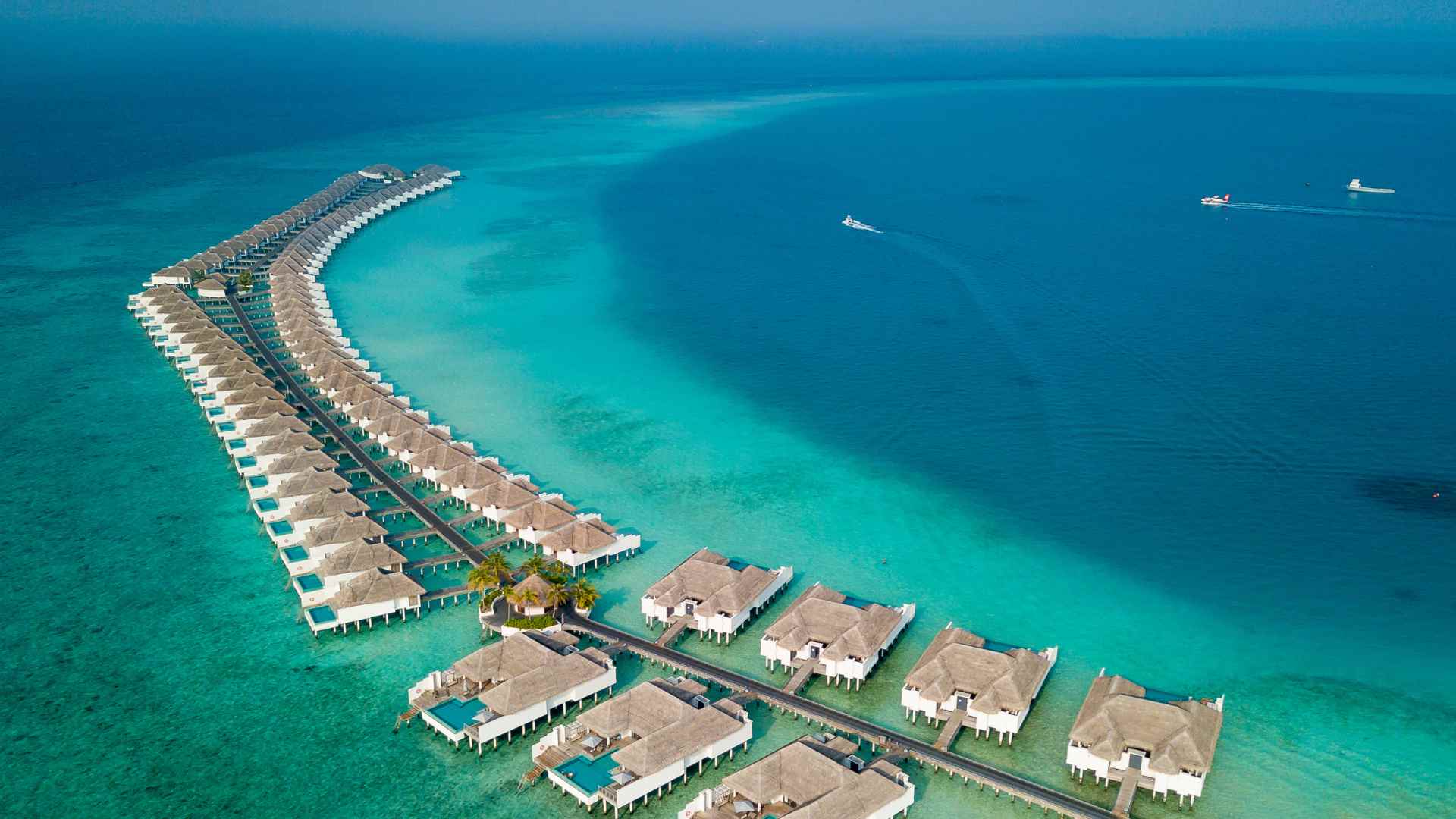 Royalton overwater bungalows extending into blue water in Antigua