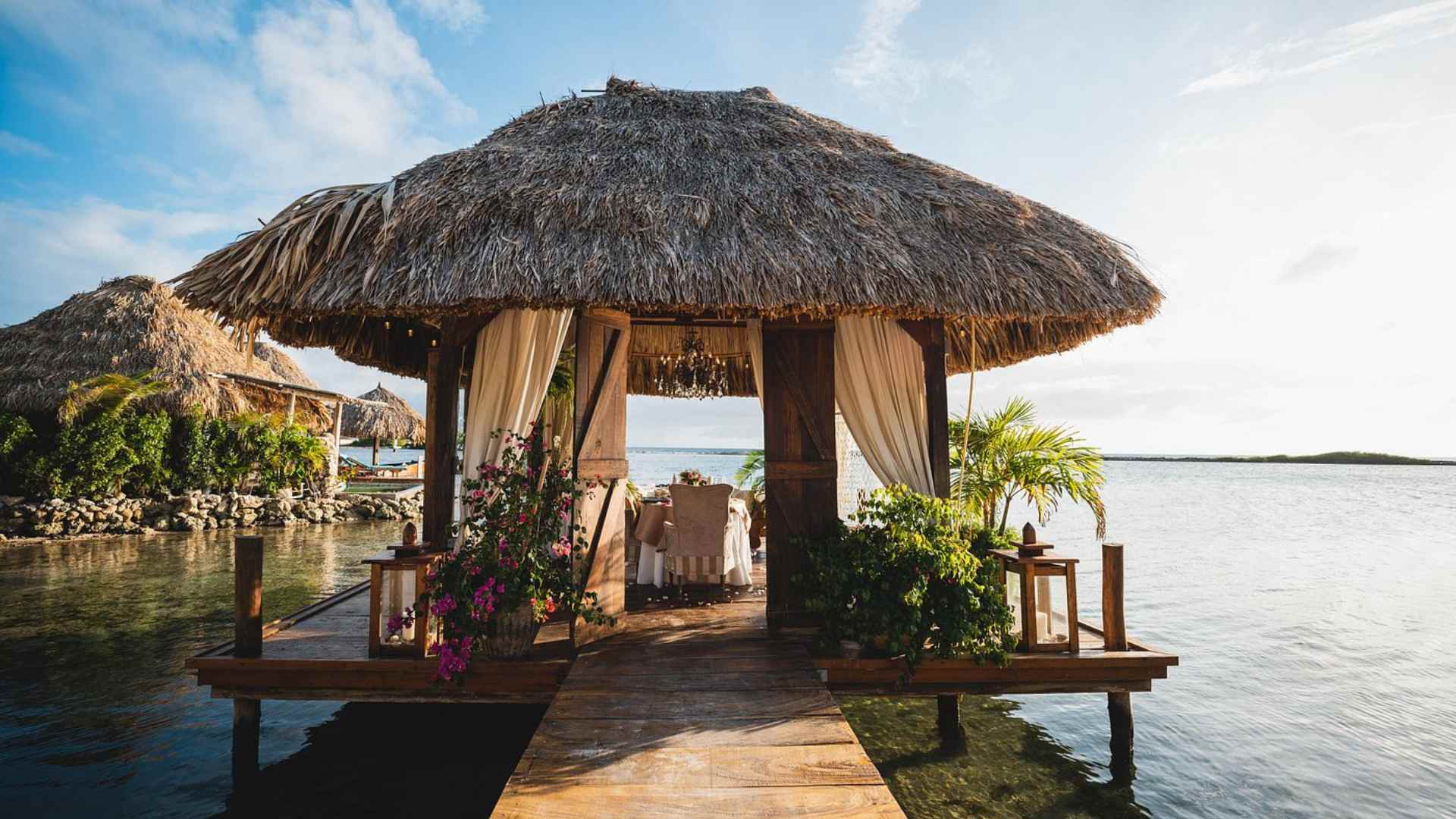 Thatched Aruba Ocean Villas accommodation above the Savaneta shoreline