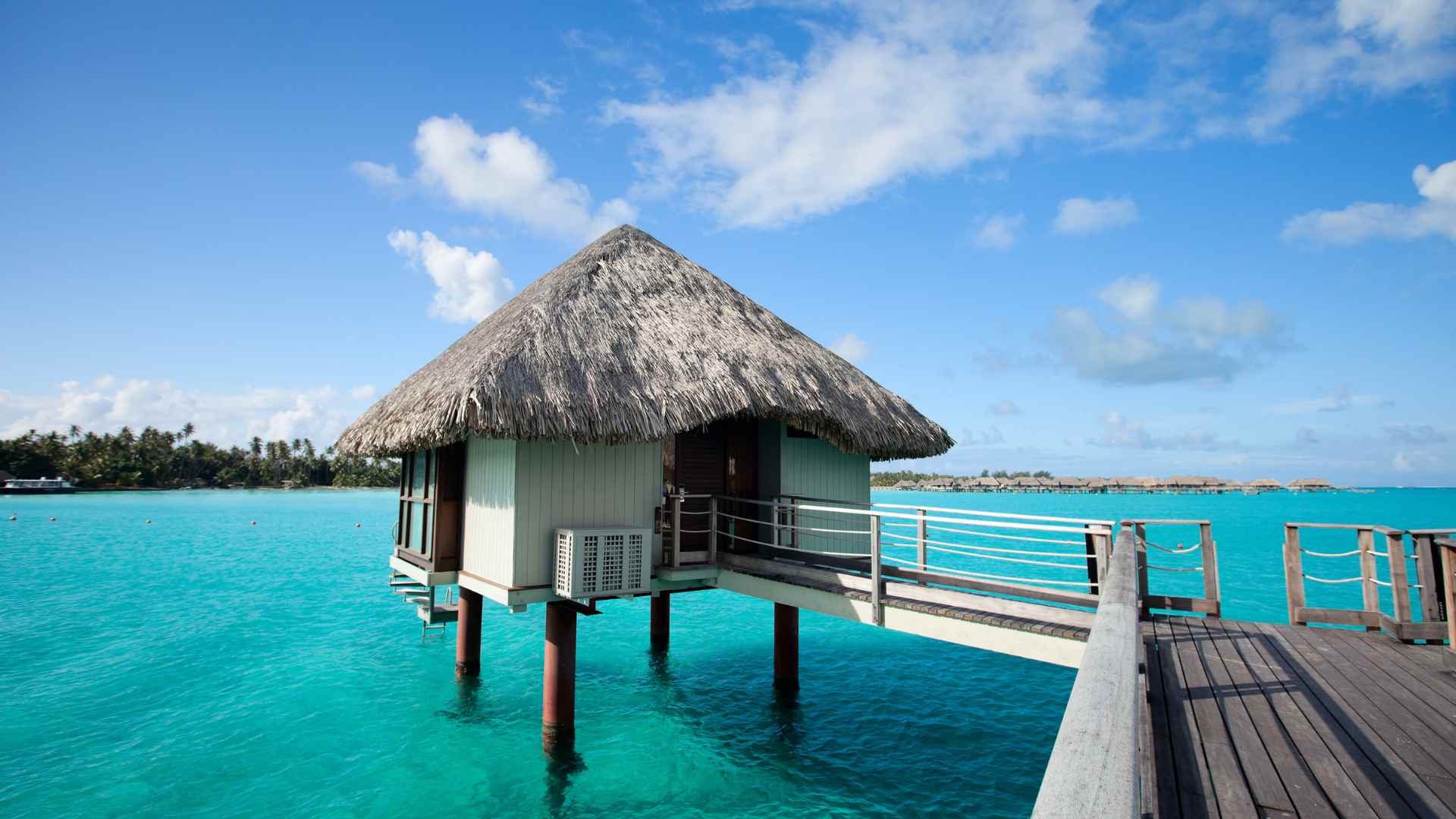 Illustrative water-focused tropical resort scene, not an ocean-overwater room in Bali