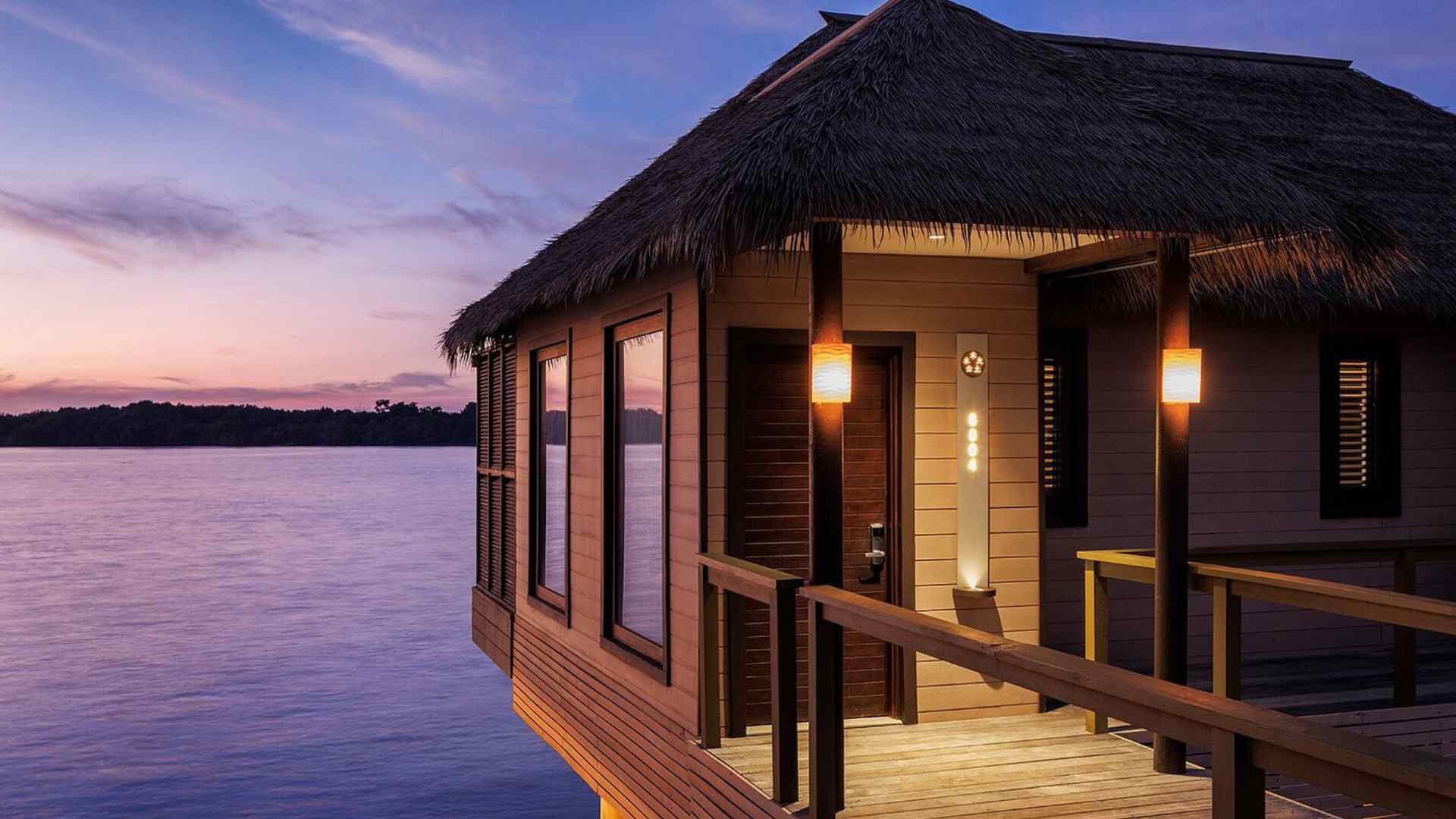 Blue Mahoe overwater villas extending from the coast at Sandals South Coast