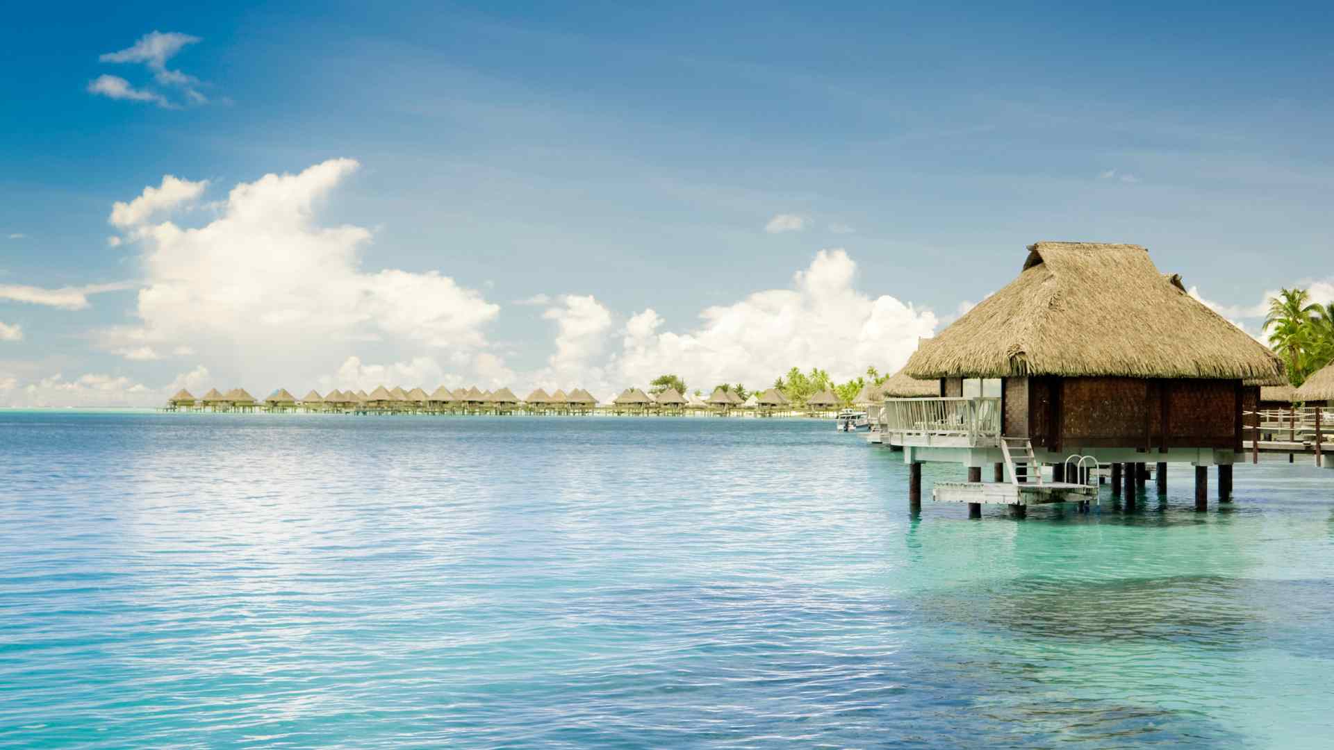 Overwater villas and tropical landscaping at Aruba Ocean Villas