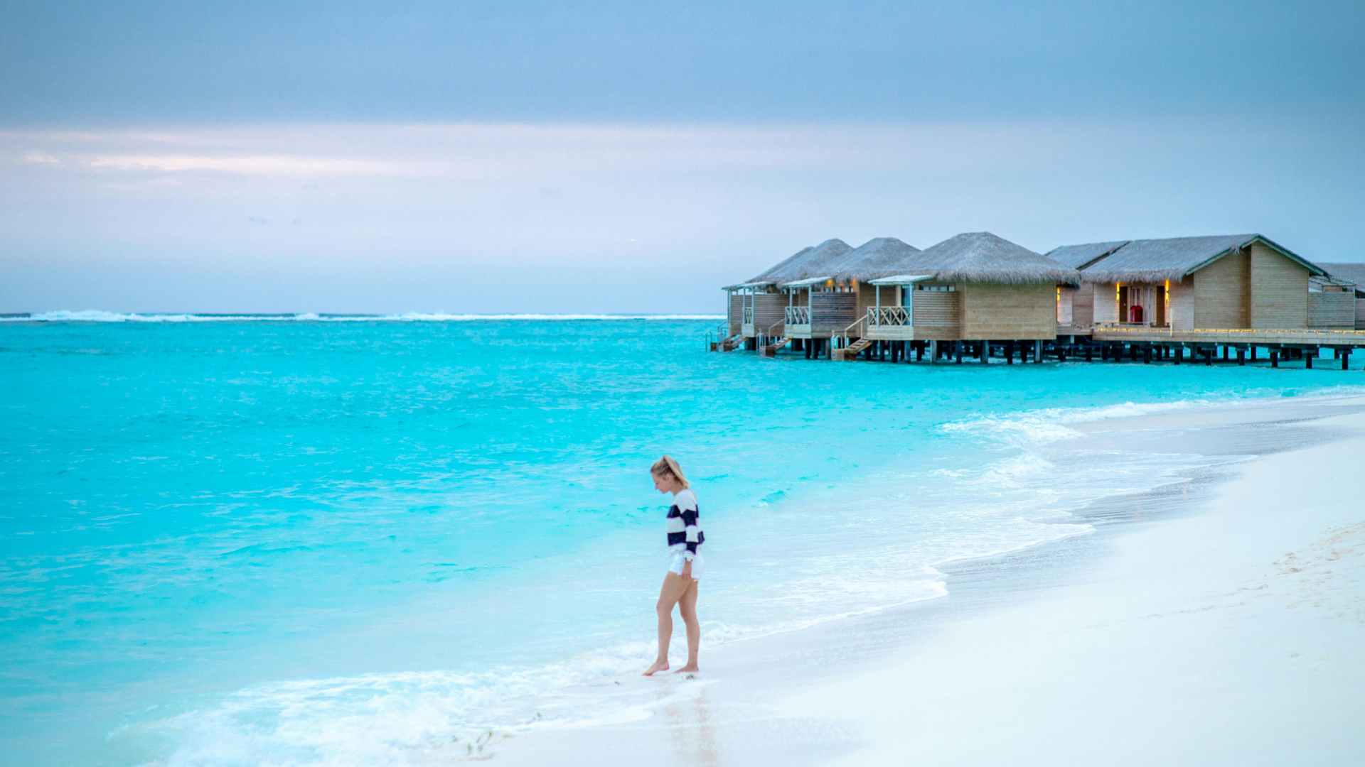 Sandals overwater villas connected to a tropical Caribbean resort