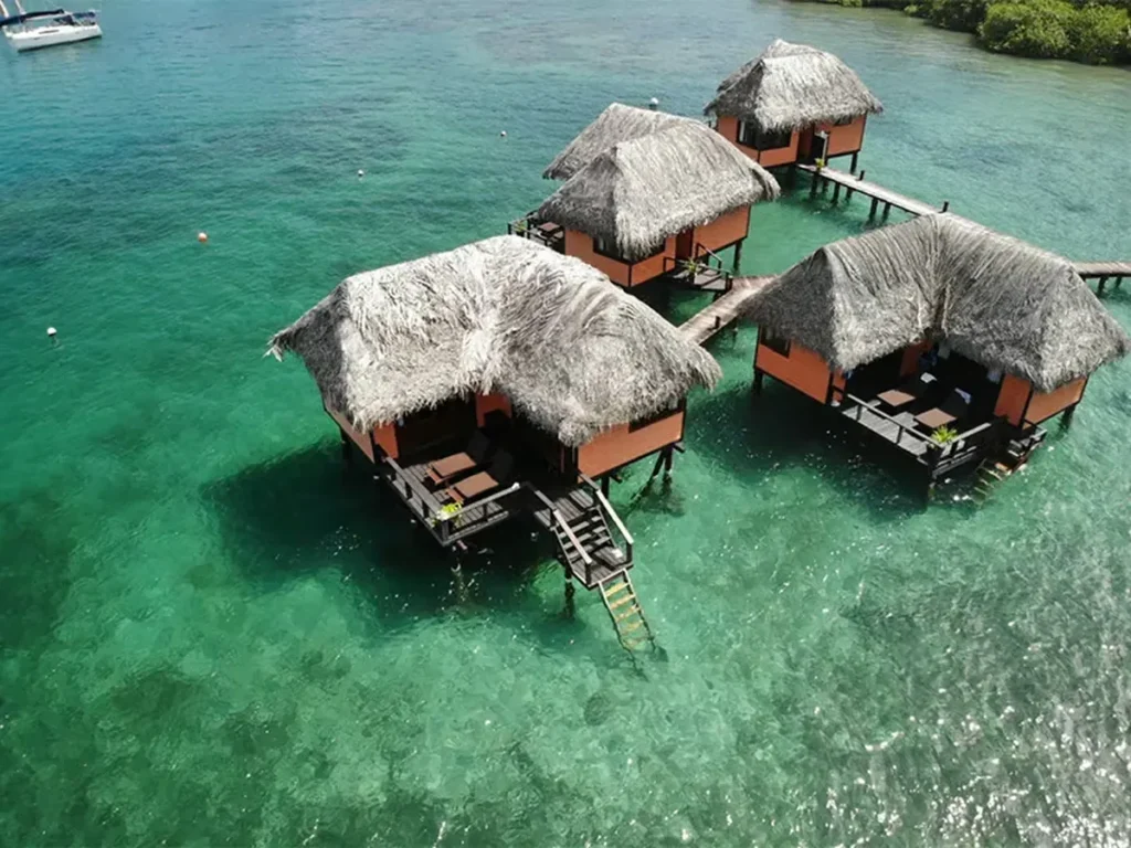 Eclypse de Mar overwater bungalows beside dense tropical forest