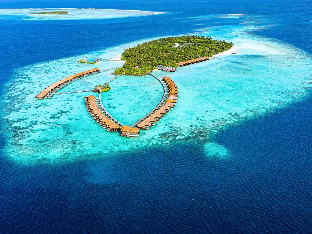 An overwater villa deck looking across a Fiji lagoon