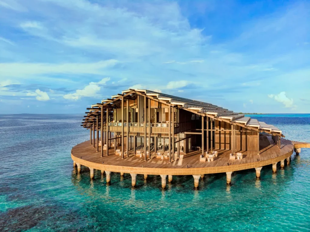 Aerial view of Kudadoo Maldives Private Island and its circular main pavilion