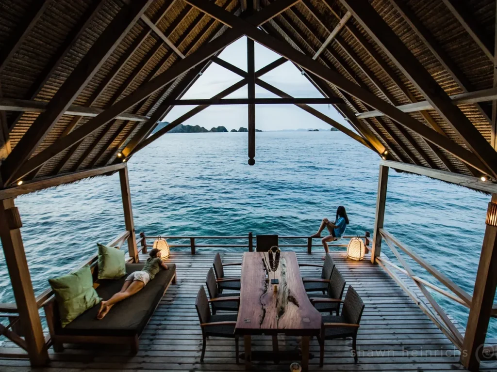 Open-air dining area in a Misool water cottage above the sea