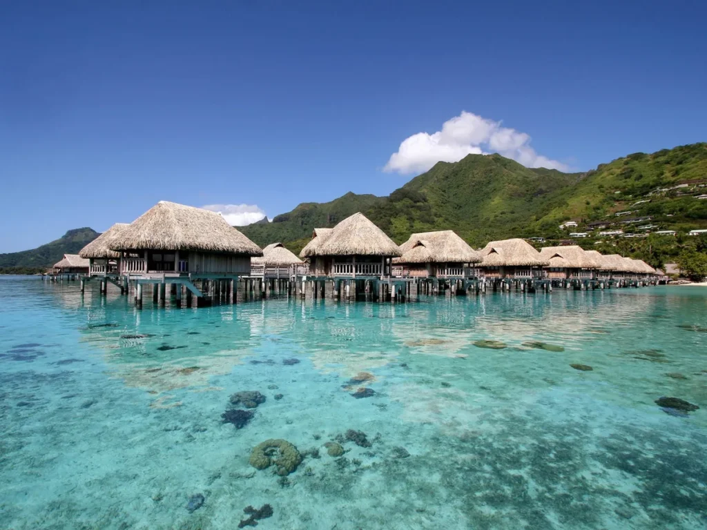 Sofitel Kia Ora Moorea overwater bungalows with green mountains behind