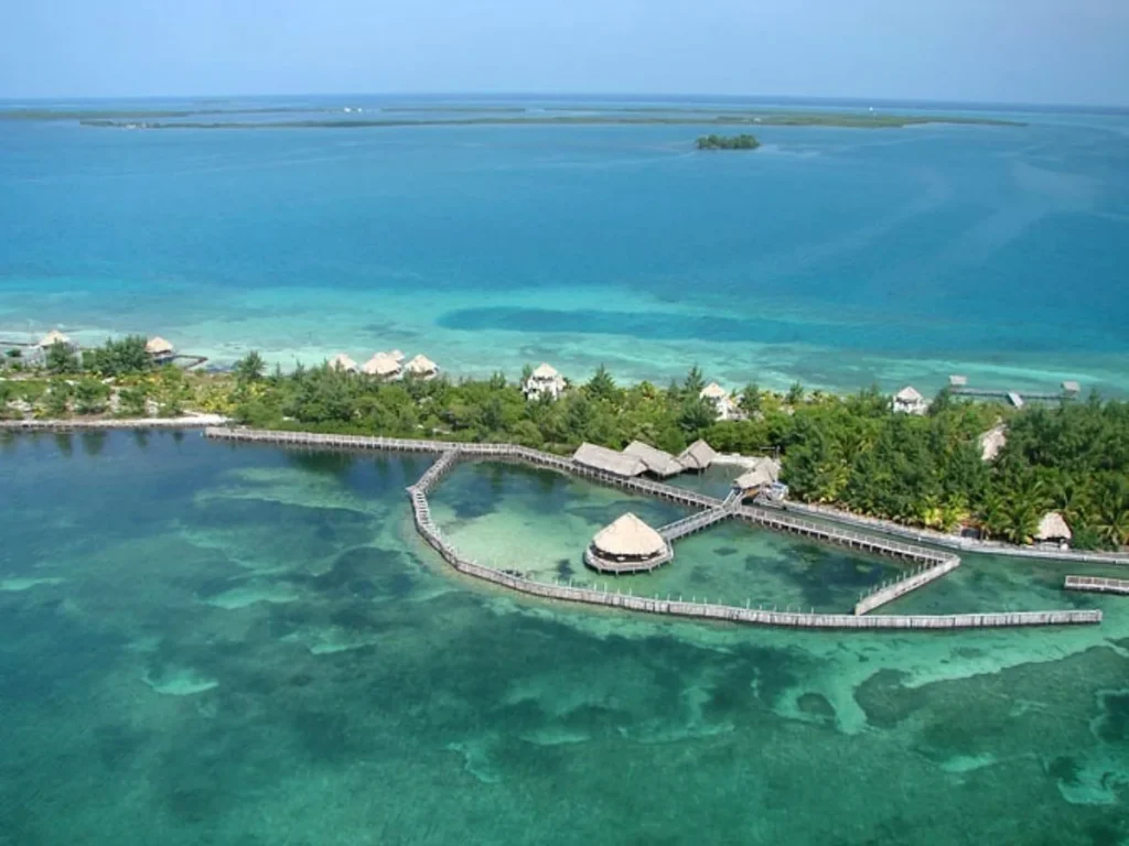 Aerial view of Thatch Caye overwater bungalow and circular jetty