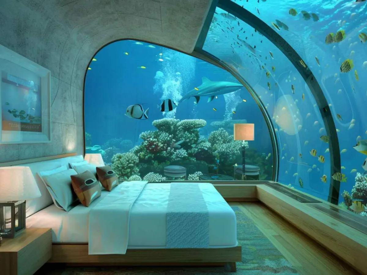 A submerged hotel room surrounded by marine life in Dubai